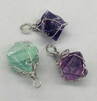 Wire Wrapped Fluorite octahedron (image for) Wire Wrapped Fluorite octahedron